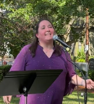 Image of Esther Rhatigan performing at Old Morse Park for the Cambridge Porchfest on July 11, 2026.